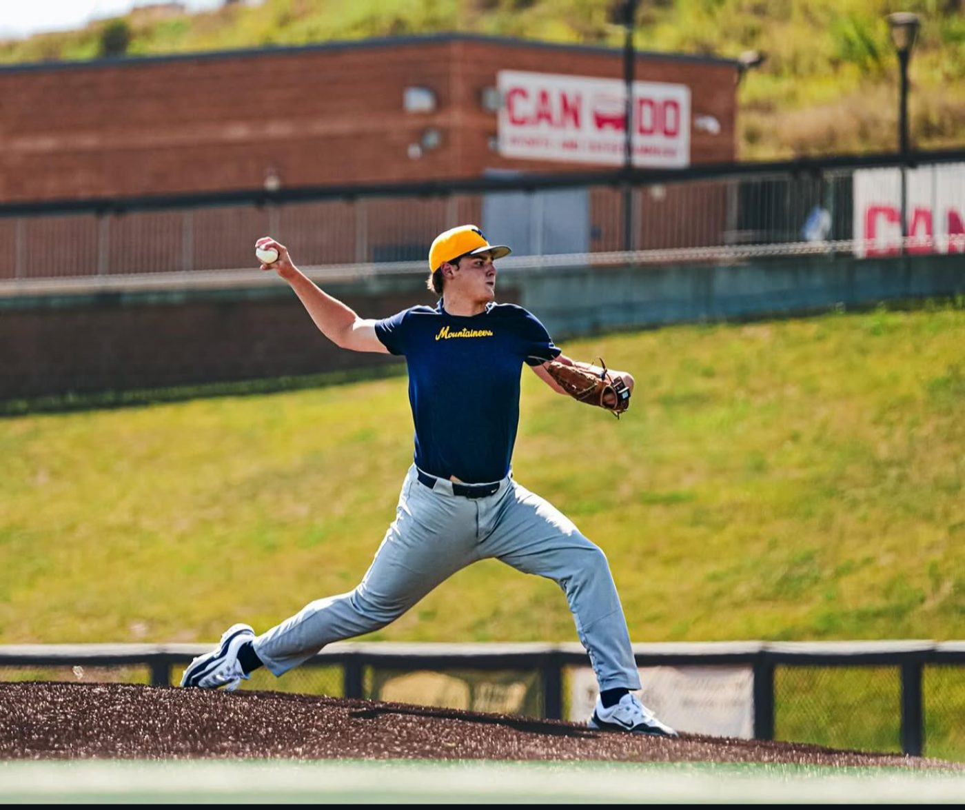 A pitcher delivering a pitch